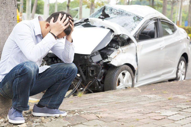 man wondering what to do right after being in a car accident